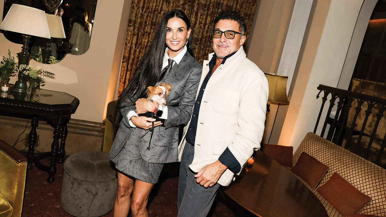 Demi Moore (with pooch Pilaf) and Chateau owner André Balazs at Brunello Cucinelli’s dinner at the hotel in October